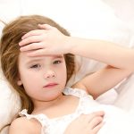 sick kid in bed