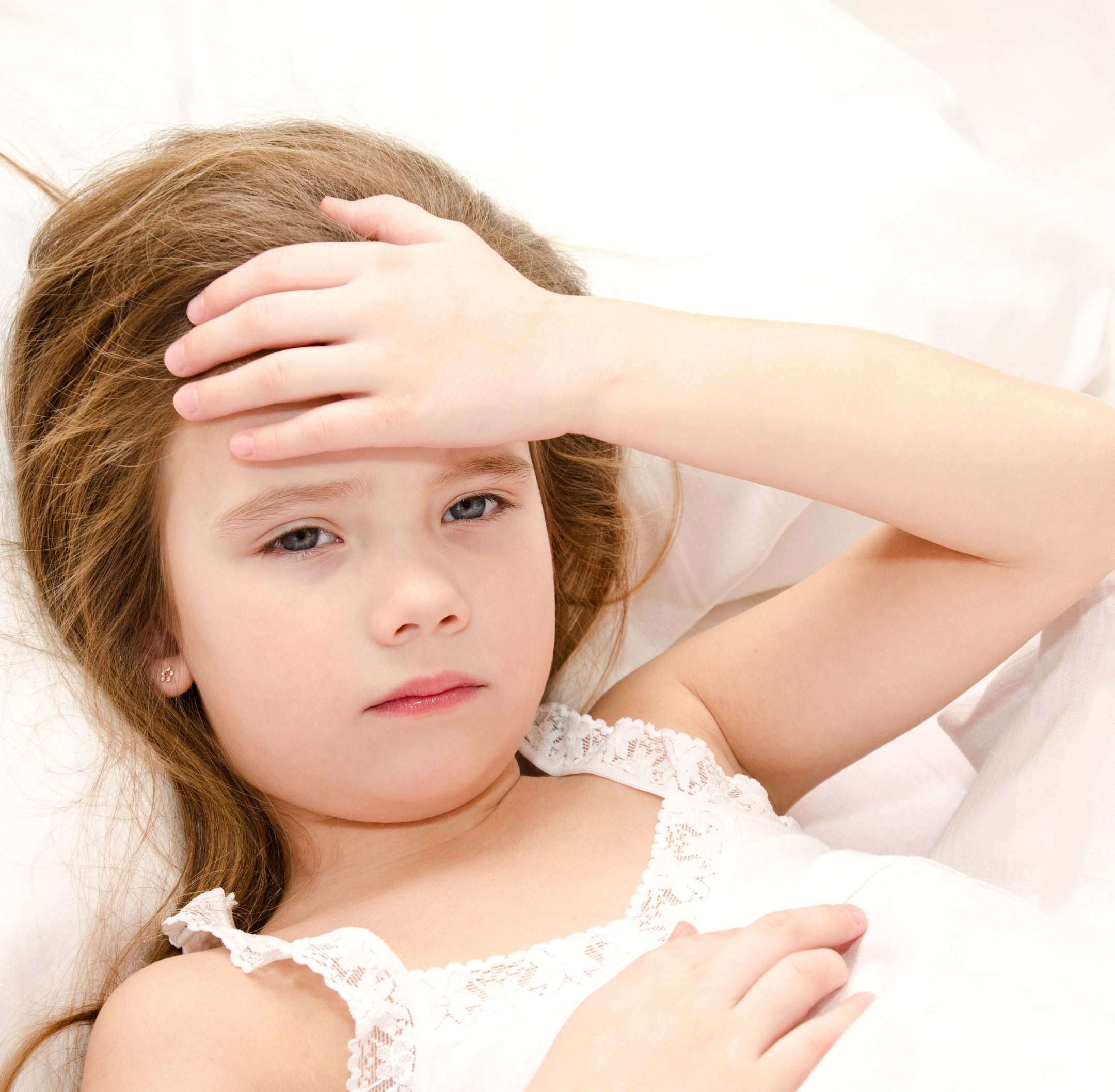 sick kid in bed